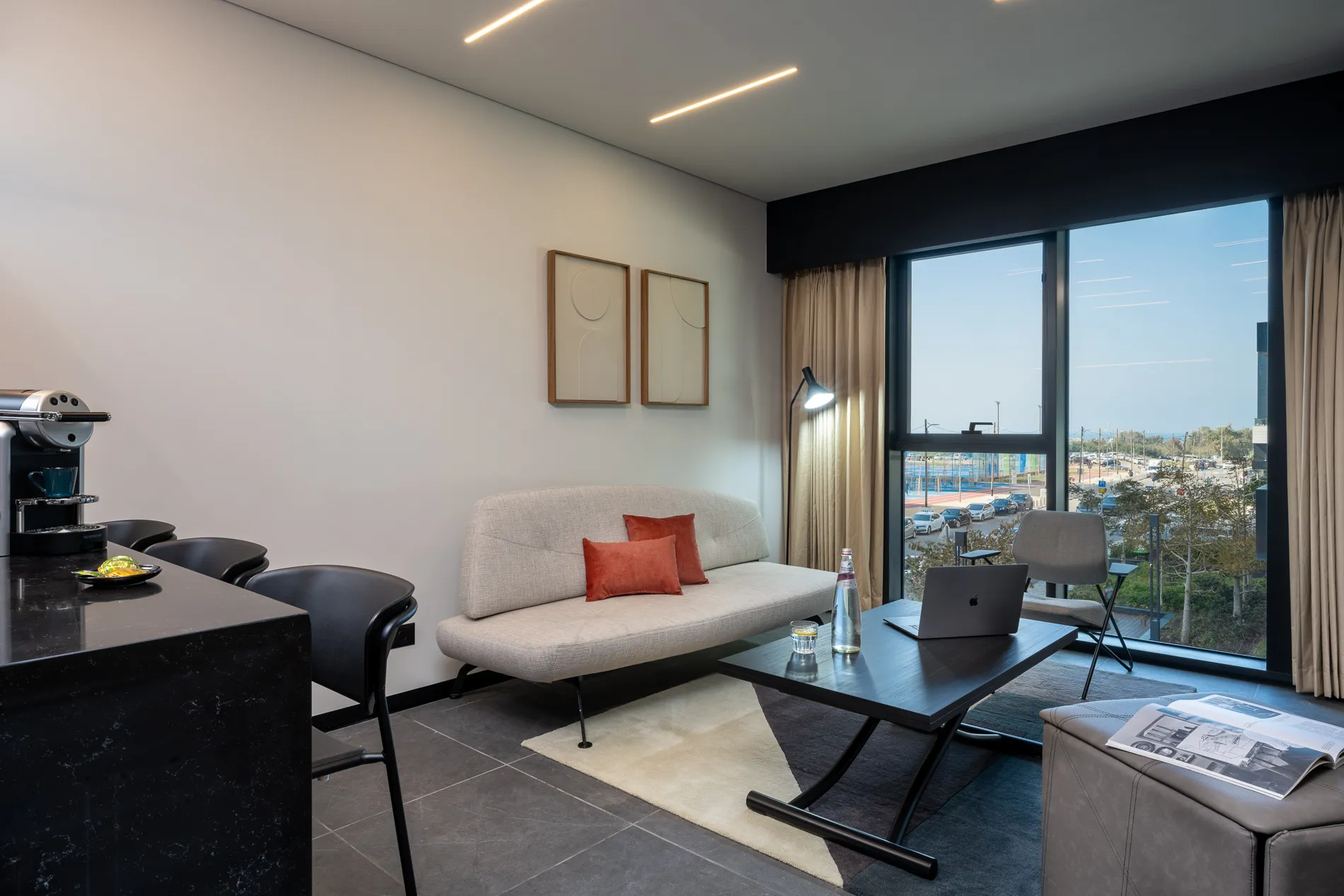 Spacious living area in the One-Bedroom Suite with Sofa Bed at master Bat Yam, featuring a stylish and comfortable sofa bed for added flexibility.