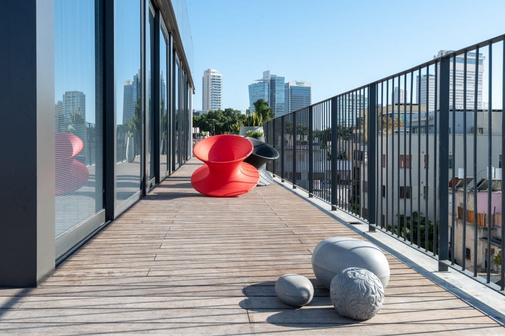 Expansive private terrace in the Four-Bedroom Penthouse at master Shenkin Tel Aviv, offering a spacious outdoor area for relaxation.
