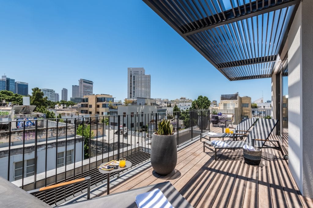 Well-designed terrace at master Shenkin Tel Aviv, blending comfort with an open-air ambiance for relaxation.