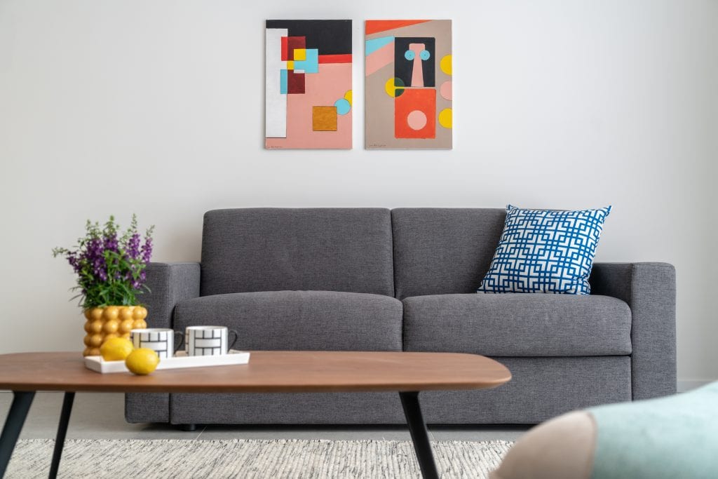 Bright and inviting living space in the Three-Bedroom Apartment at master Shenkin Tel Aviv, designed for comfort with contemporary decor