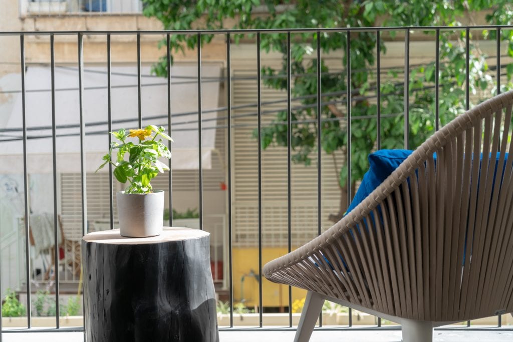 Cozy private balcony in the Two-Bedroom Apartment at master Shenkin Tel Aviv, offering an inviting outdoor retreat