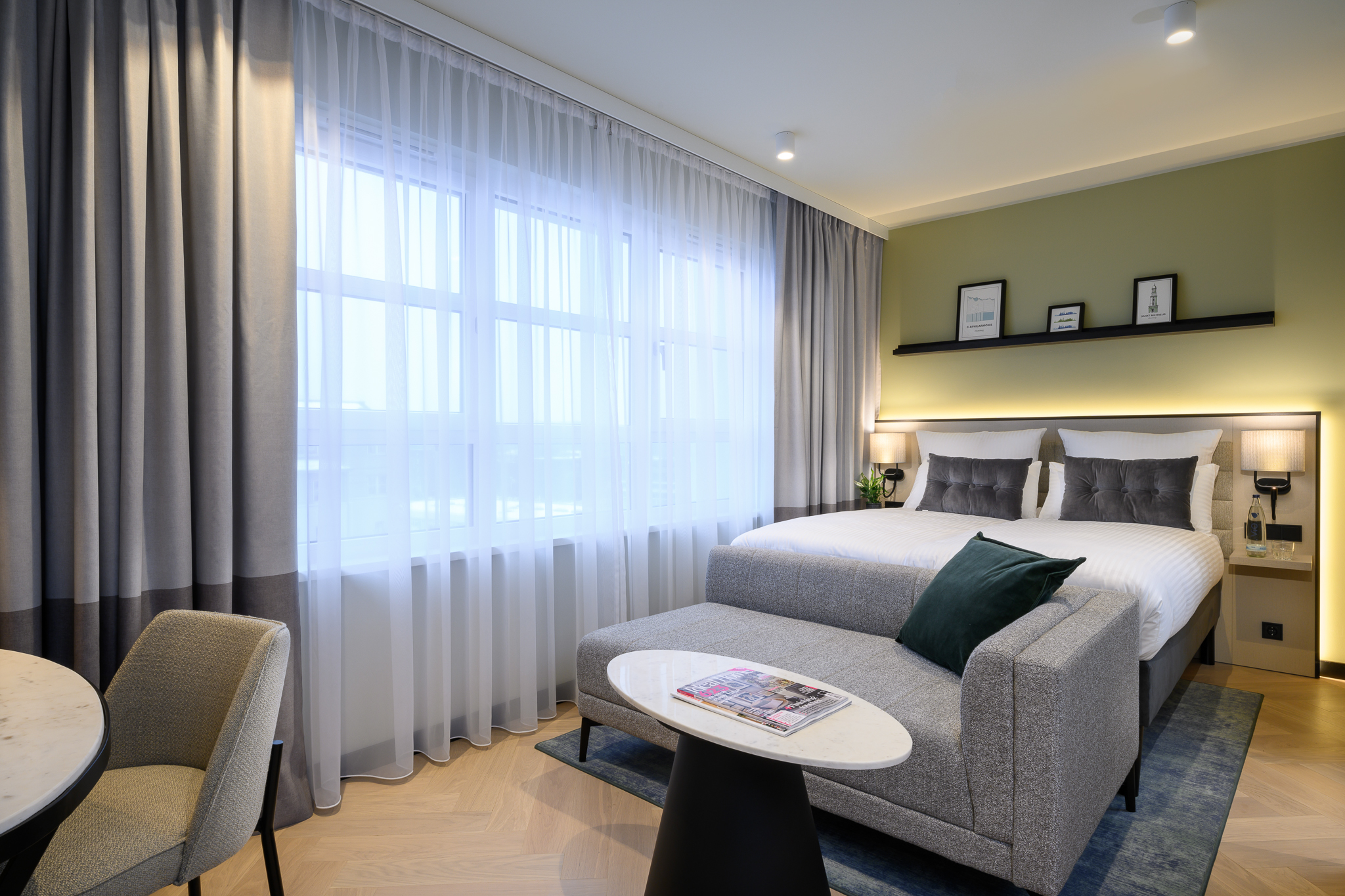 Spacious and cozy bedroom in the Family Apartment at master Altona Hamburg, designed with modern decor and a comfortable sleeping area