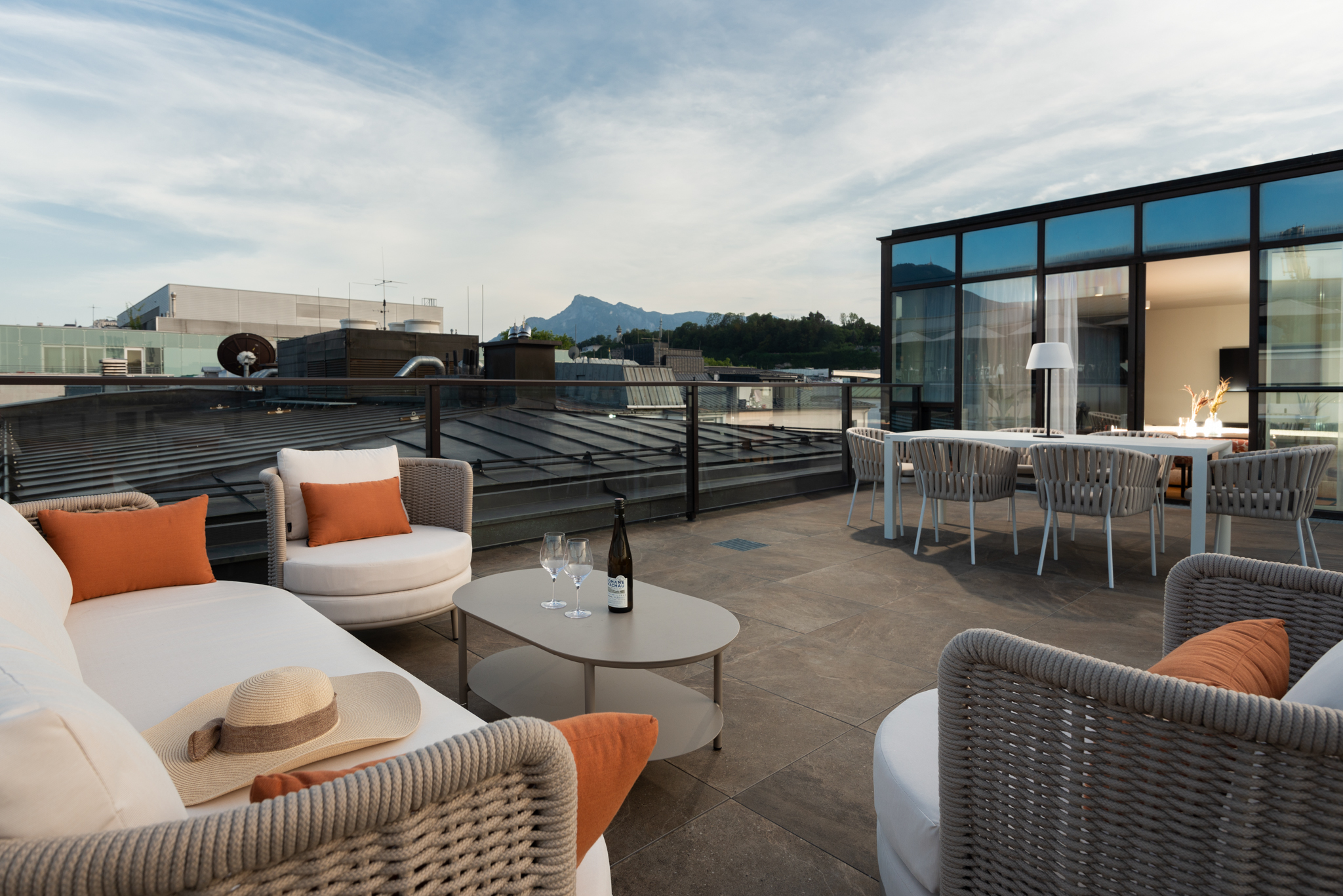 Penthouse terrace at master Mirabell featuring cozy sofas and a stylish outdoor seating area.
