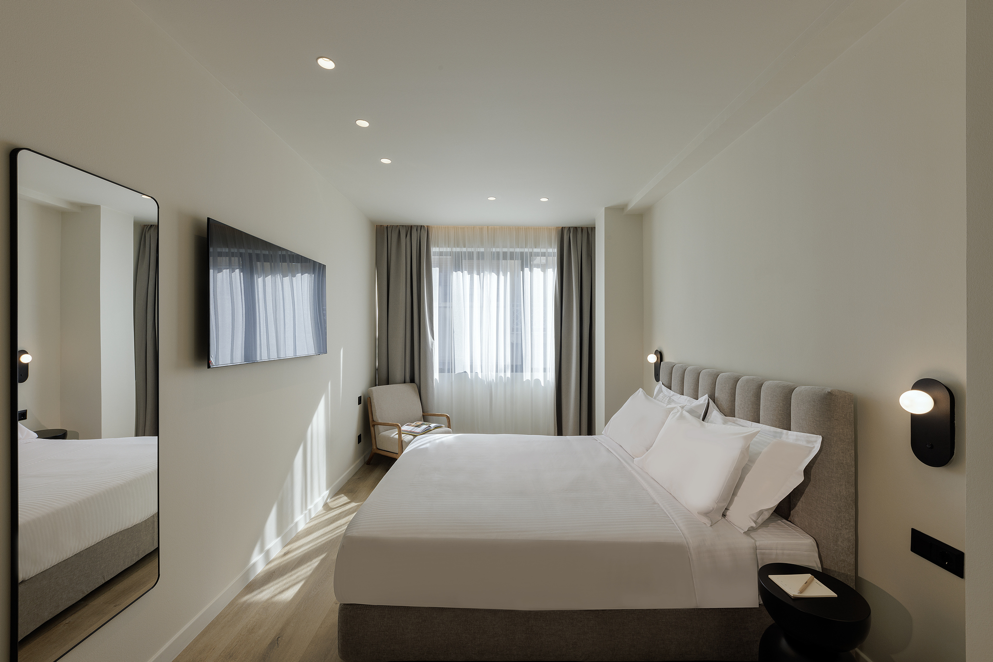 Comfortable sleeping area in the Studio Apartment at master Plaka Athens, blending warm tones with elegant decor.