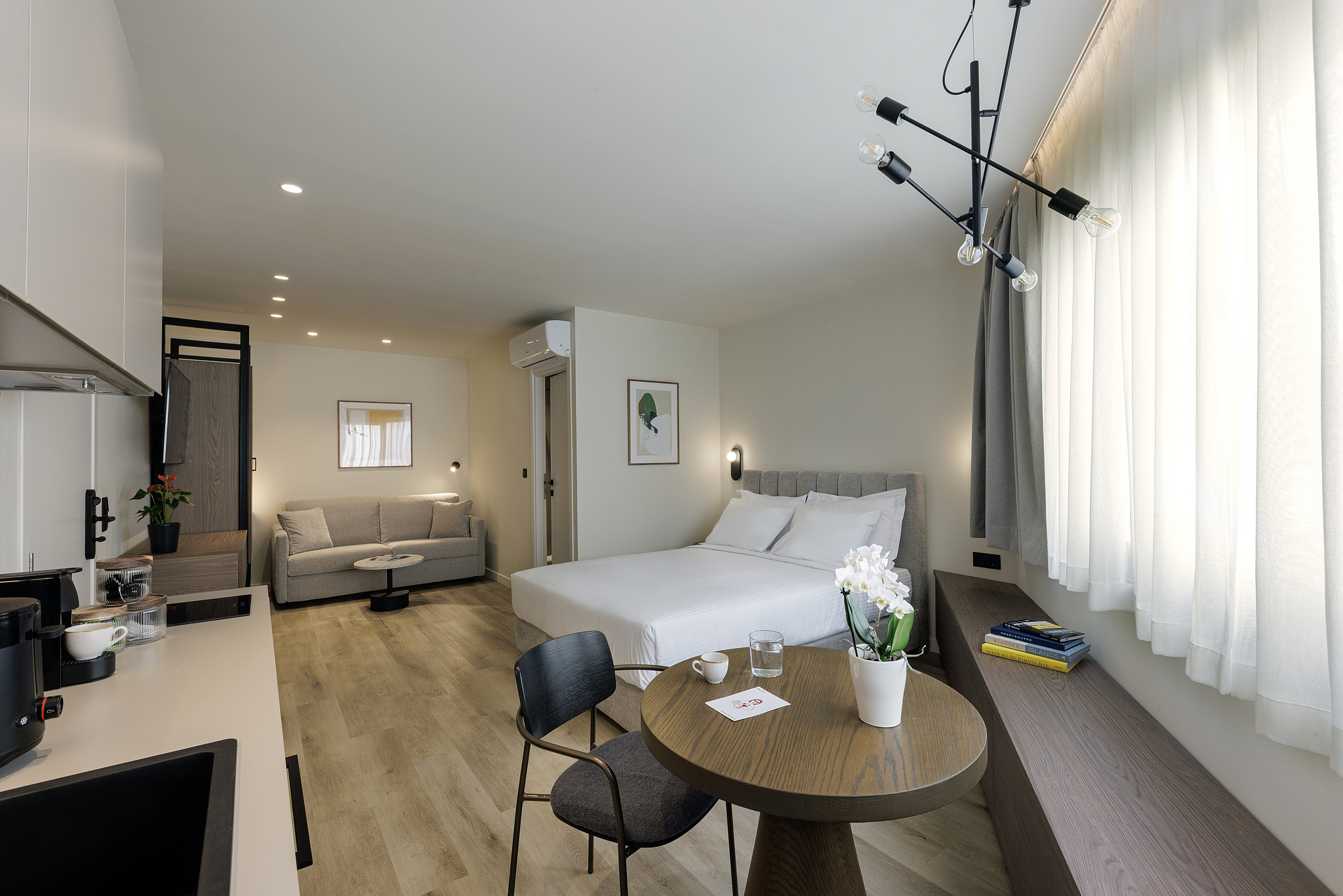 Cozy bed in the Studio with Sofa Bed at master Plaka Athens, designed for a restful and comfortable stay.