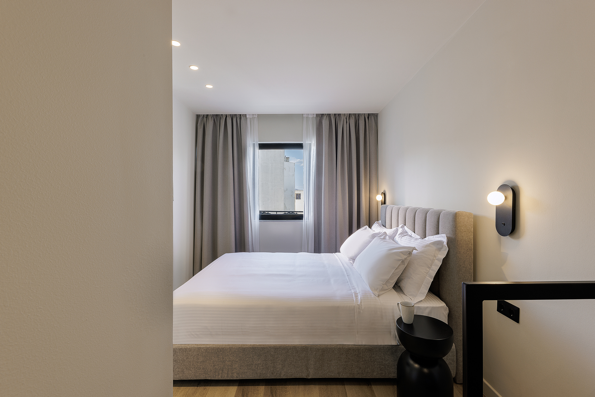 Comfortable bedroom in the One Bedroom Apartment with Balcony at master Plaka Athens, featuring a plush bed and a soothing ambiance.