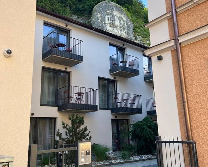 Street view of master Linzergasse Serviced Apartments in Salzburg, showcasing its contemporary architecture nestled within the historic cityscape.