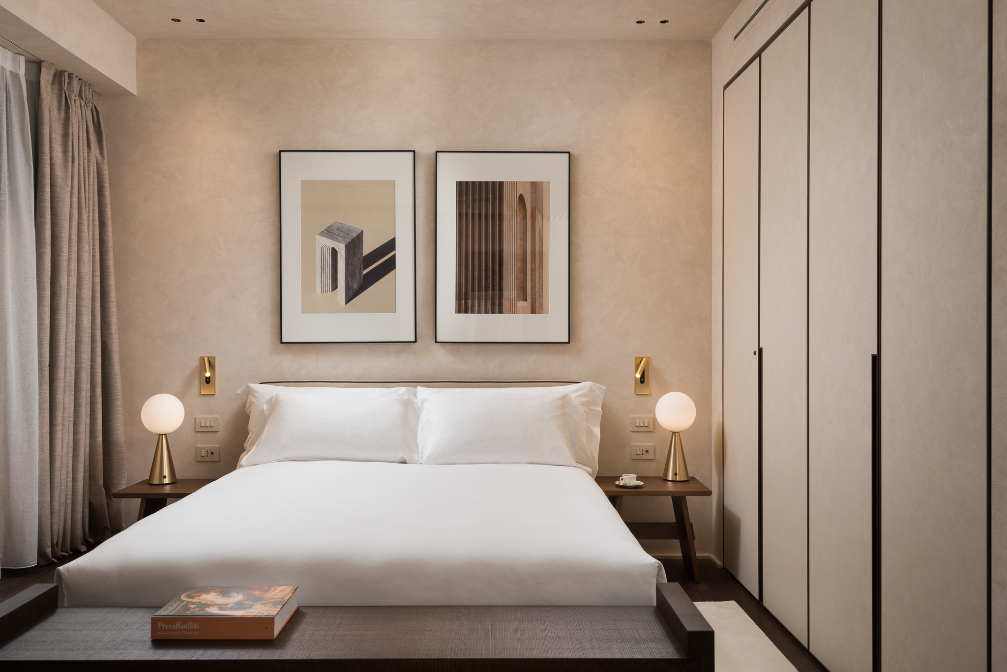 Elegant bedroom in a master Trevi Rome apartment, featuring a plush bed and stylish decor for a comfortable stay.