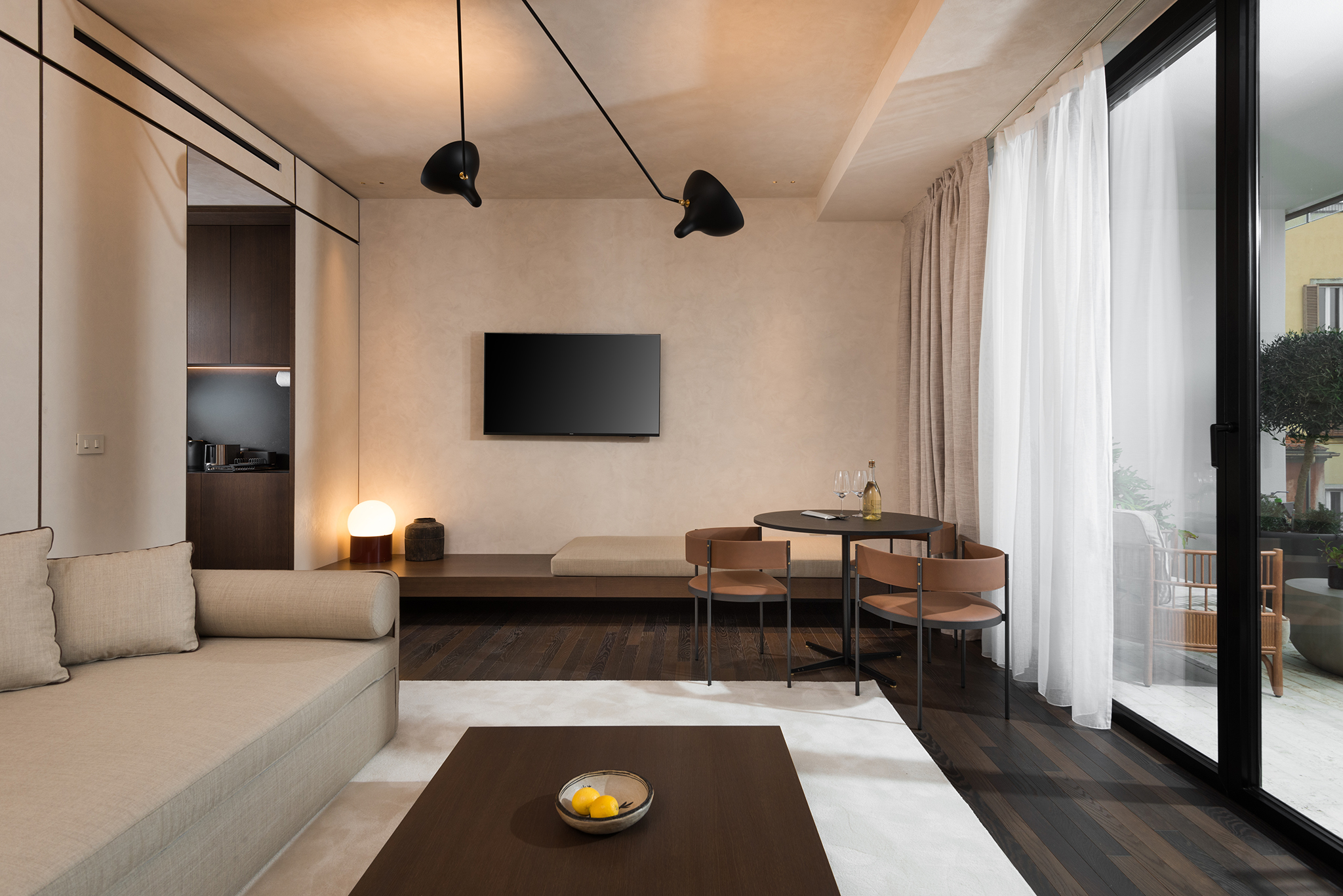 Modern living space in the One-Bedroom Apartment with Big Terrace at master Trevi Rome, seamlessly connecting to the outdoor balcony.