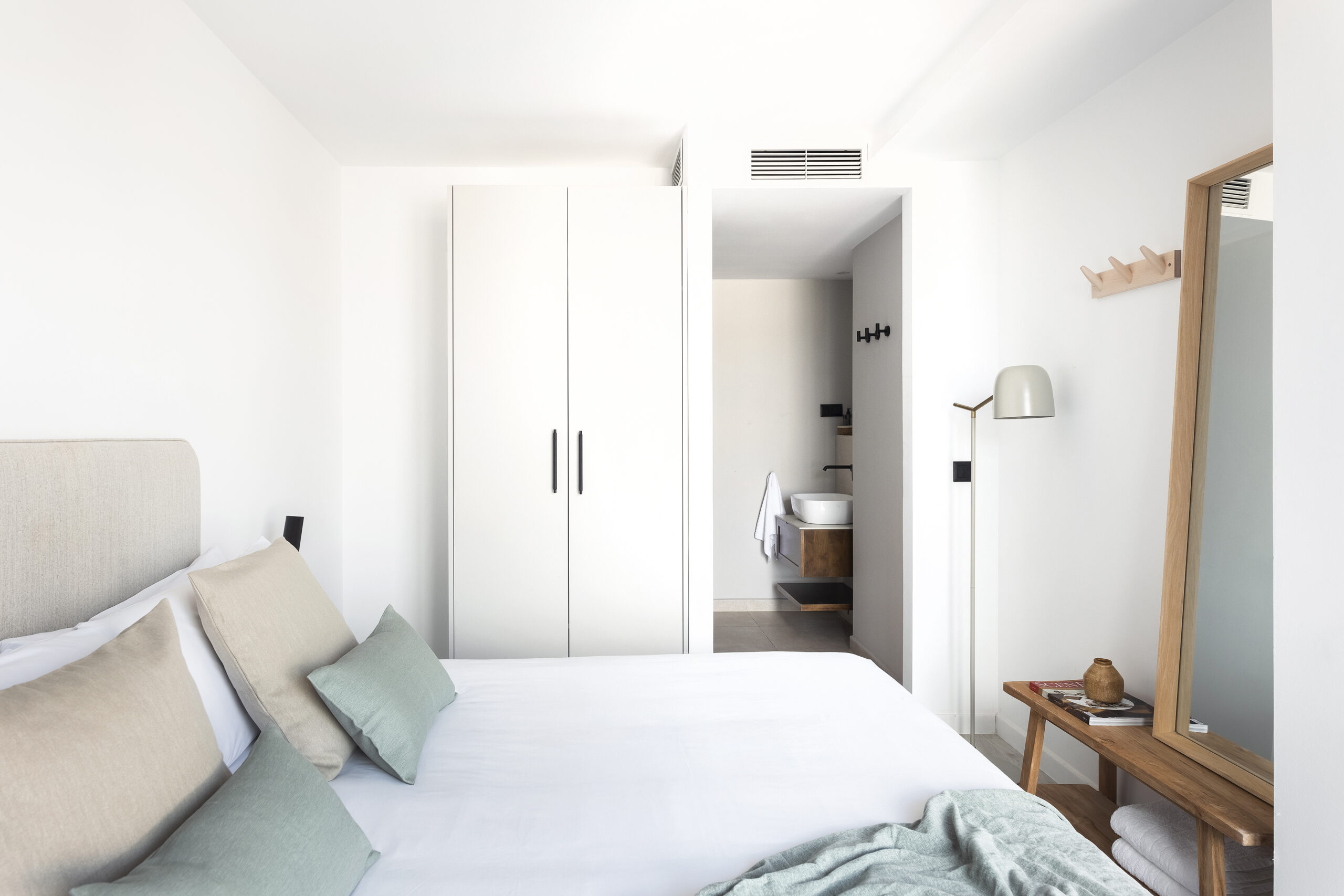 One Bedroom Apartment at master La Rambla Barcelona with double bed, wardrobe, full-length mirror, and en-suite bathroom.