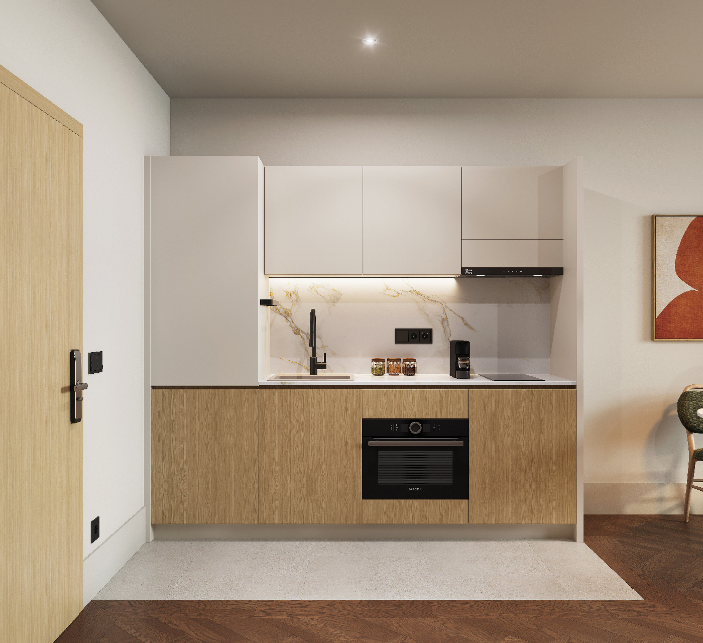 Contemporary kitchenette with built-in oven, induction hob, and minimalist cabinetry in master Wola Warsaw studio.