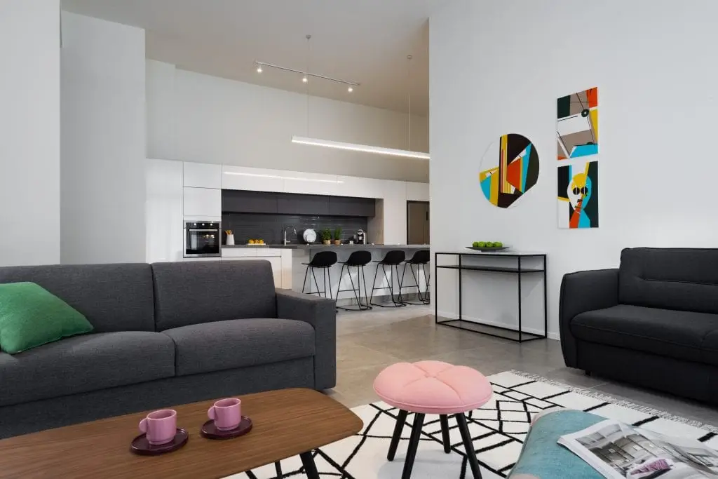 Modern and functional kitchen in the Five-Bedroom Duplex Garden at master Shenkin Tel Aviv, featuring sleek cabinetry and contemporary appliances