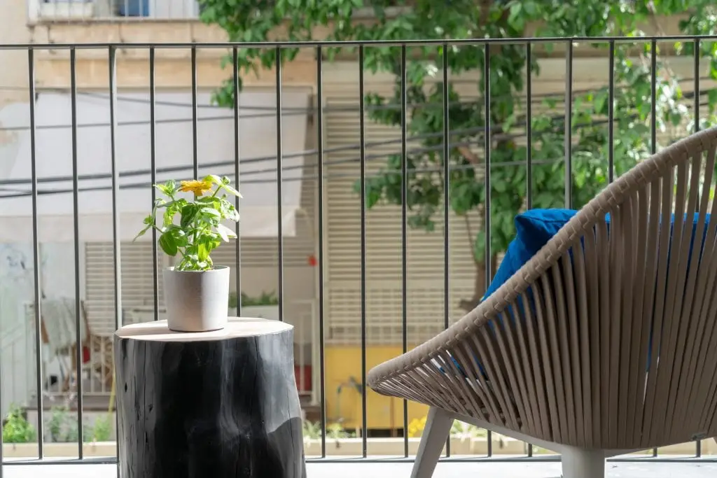 Cozy private balcony in the Two-Bedroom Apartment at master Shenkin Tel Aviv, offering an inviting outdoor retreat