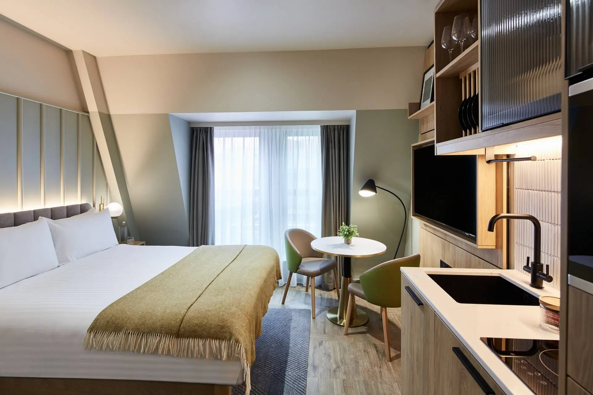 Well-designed Studio at master St. Paul’s London, offering an open-plan layout with a comfortable bed, functional kitchenette, and dining space.