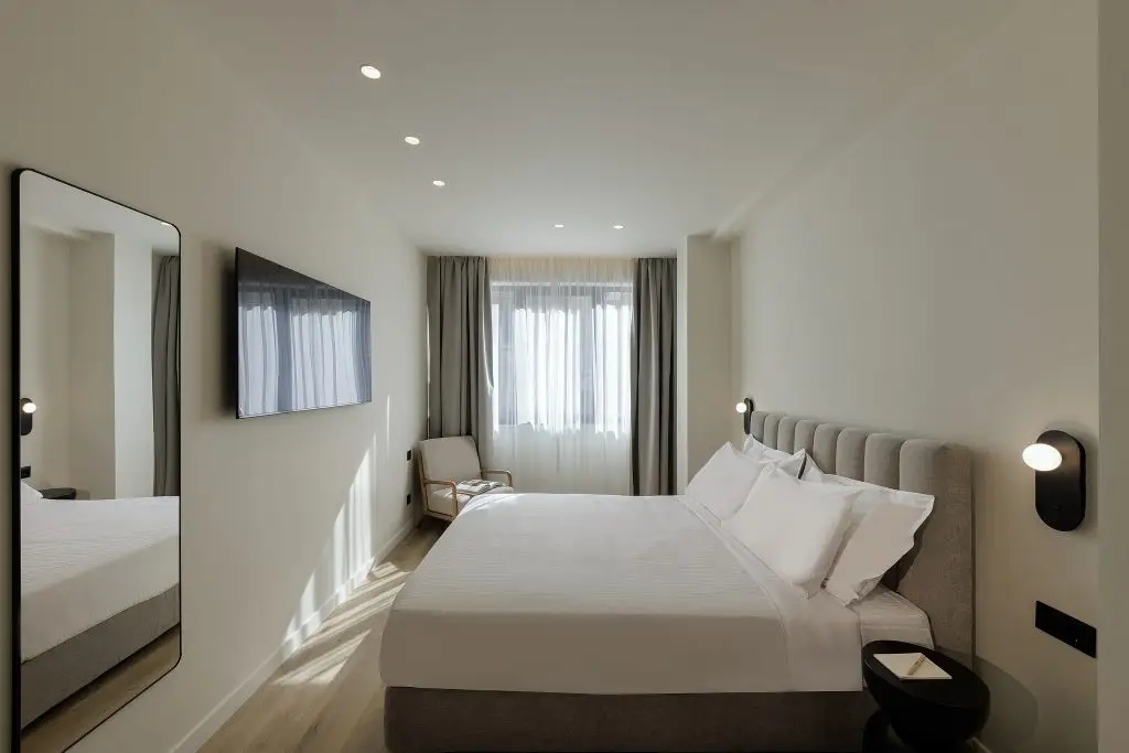 Comfortable sleeping area in the Studio Apartment at master Plaka Athens, blending warm tones with elegant decor.