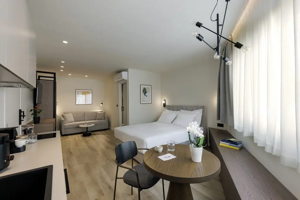 Cozy bed in the Studio with Sofa Bed at master Plaka Athens, designed for a restful and comfortable stay.