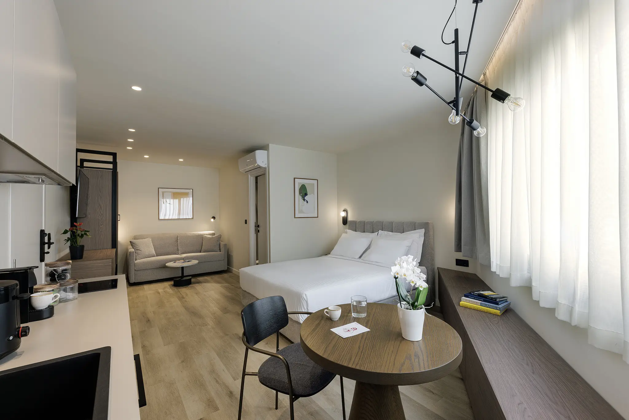 Cozy bed in the Studio with Sofa Bed at master Plaka Athens, designed for a restful and comfortable stay.