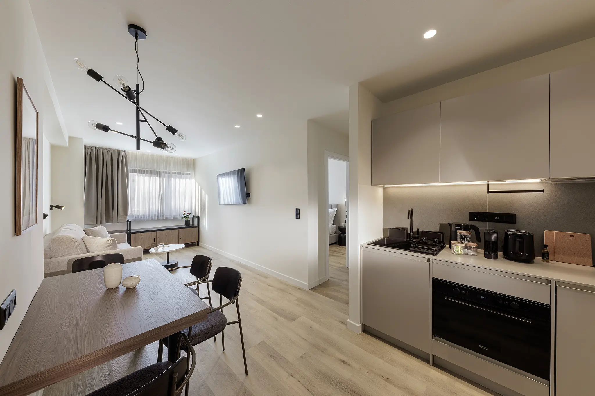 Modern kitchen in the One Bedroom Apartment at master Plaka Athens, equipped with sleek appliances and a functional layout.
