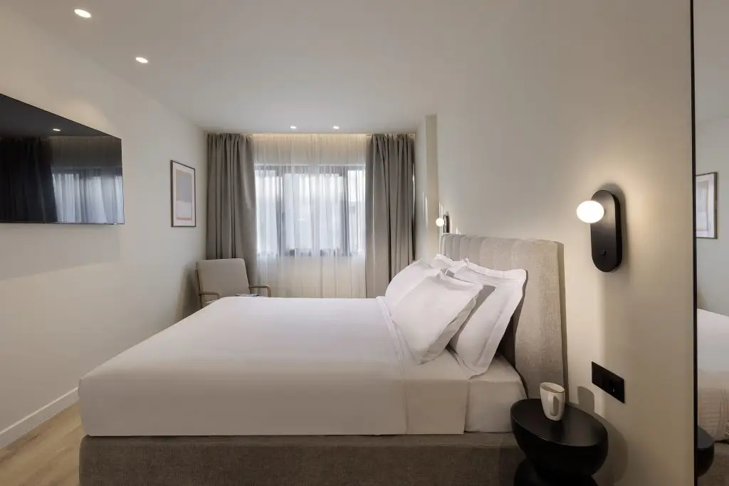 Modern and stylish sleeping area in the One Bedroom Apartment at master Plaka Athens, designed for comfort and relaxation.