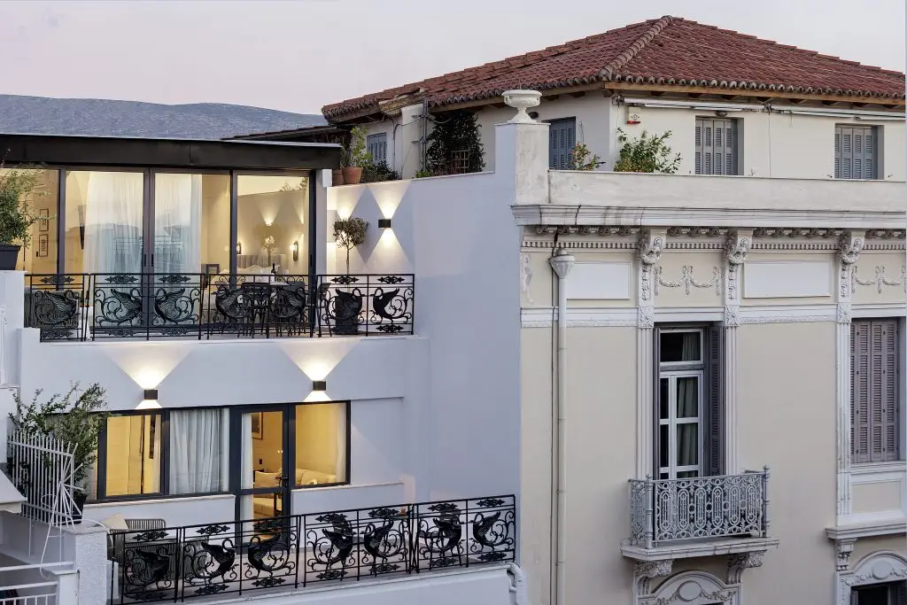 Exterior of master Plaka Athens, a modern serviced apartment building blending seamlessly with the historic charm of the Plaka neighborhood.