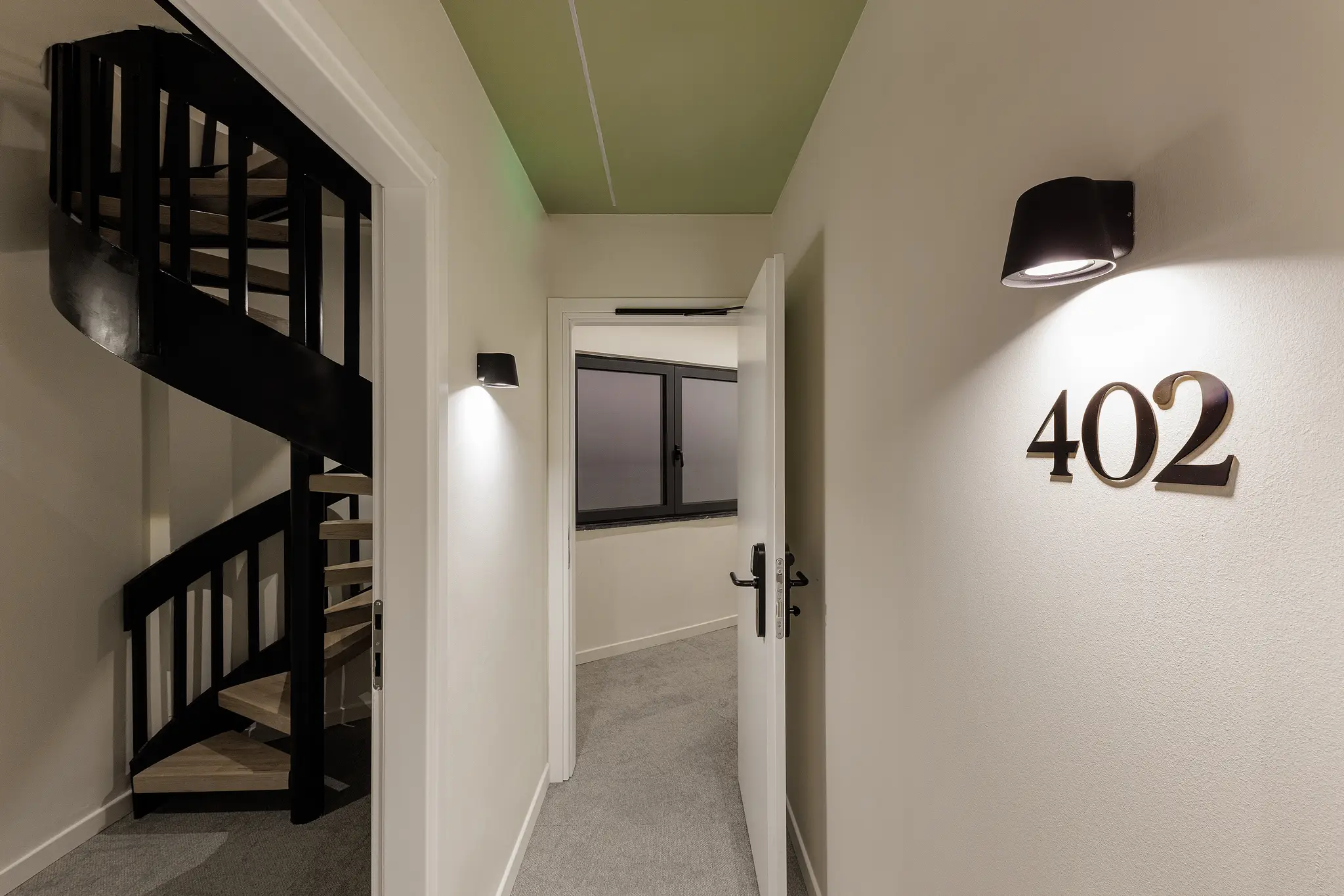 Entrance to the Family Room at master Plaka Athens, featuring a sleek door with the room number clearly displayed