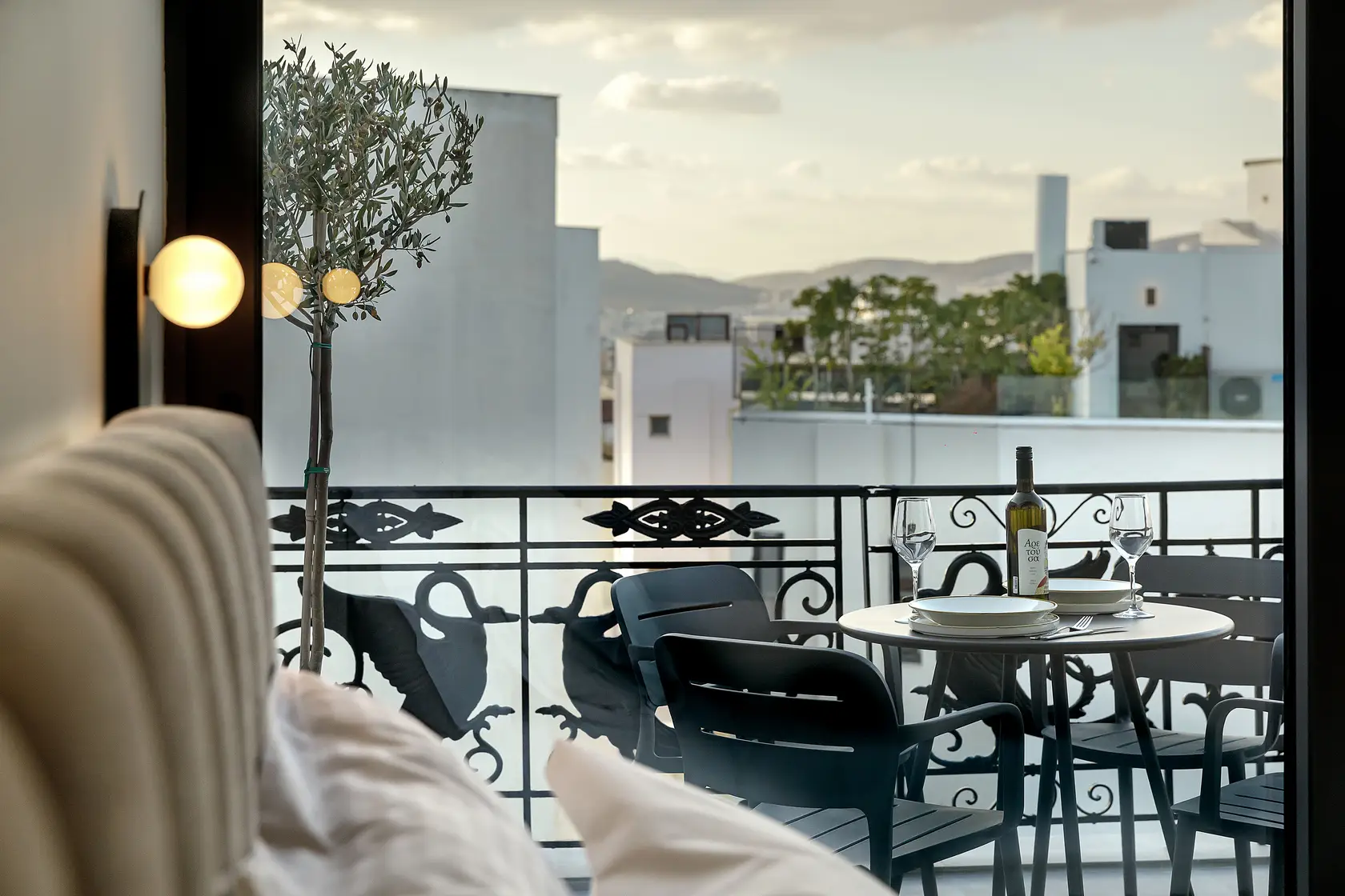 Private balcony in the Family Room at master Plaka Athens, overlooking the charming streets and rooftops of Athens.