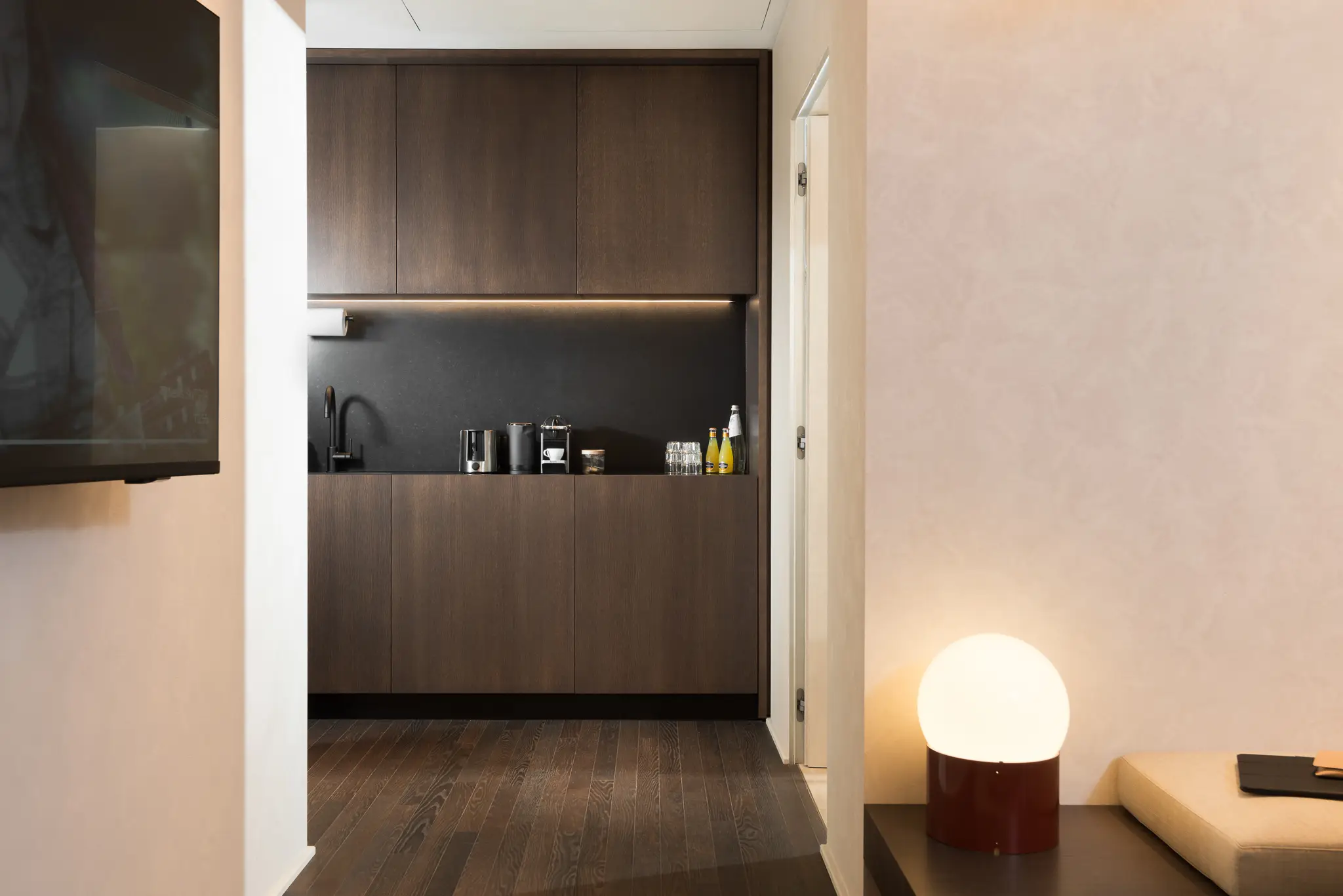 Modern kitchenette in the Studio Apartment at master Trevi Rome, equipped with sleek appliances and a functional layout for convenience.
