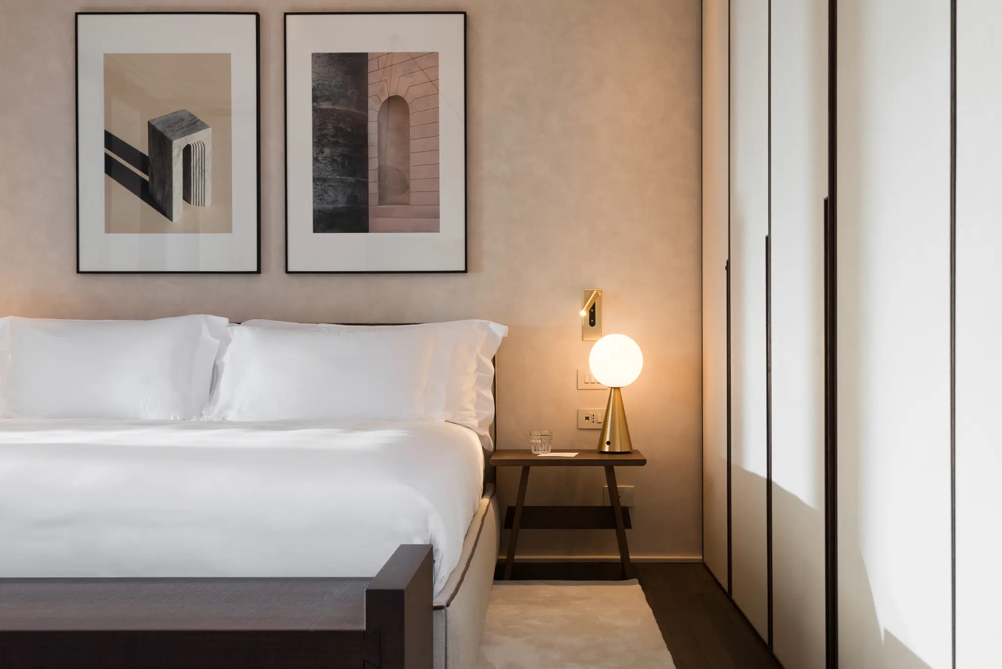 Elegant bedroom area in the Studio with Balcony at master Trevi Rome, featuring a plush bed and soft lighting for ultimate comfort.