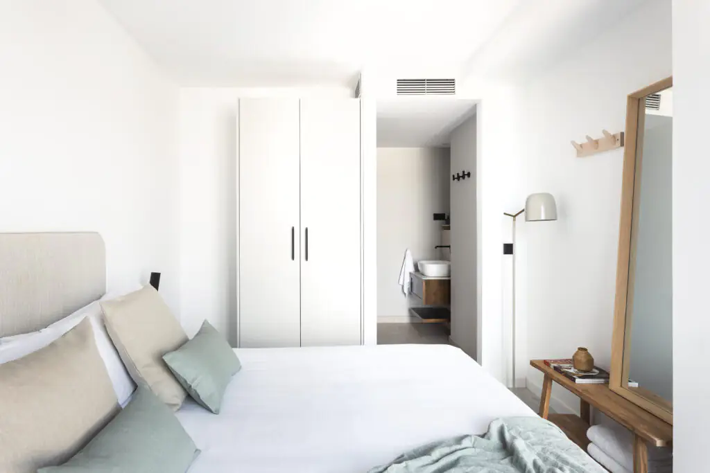 One Bedroom Apartment at master La Rambla Barcelona with double bed, wardrobe, full-length mirror, and en-suite bathroom.